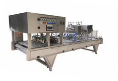 Automatic machine for filling and sealing marmalade cups